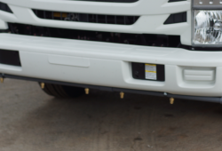 The chassis front bumper mounted spray bar